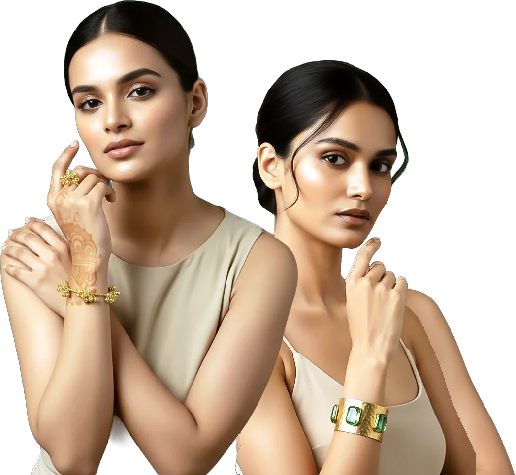 Two models wearing a gold bracelet and an emerald cuff